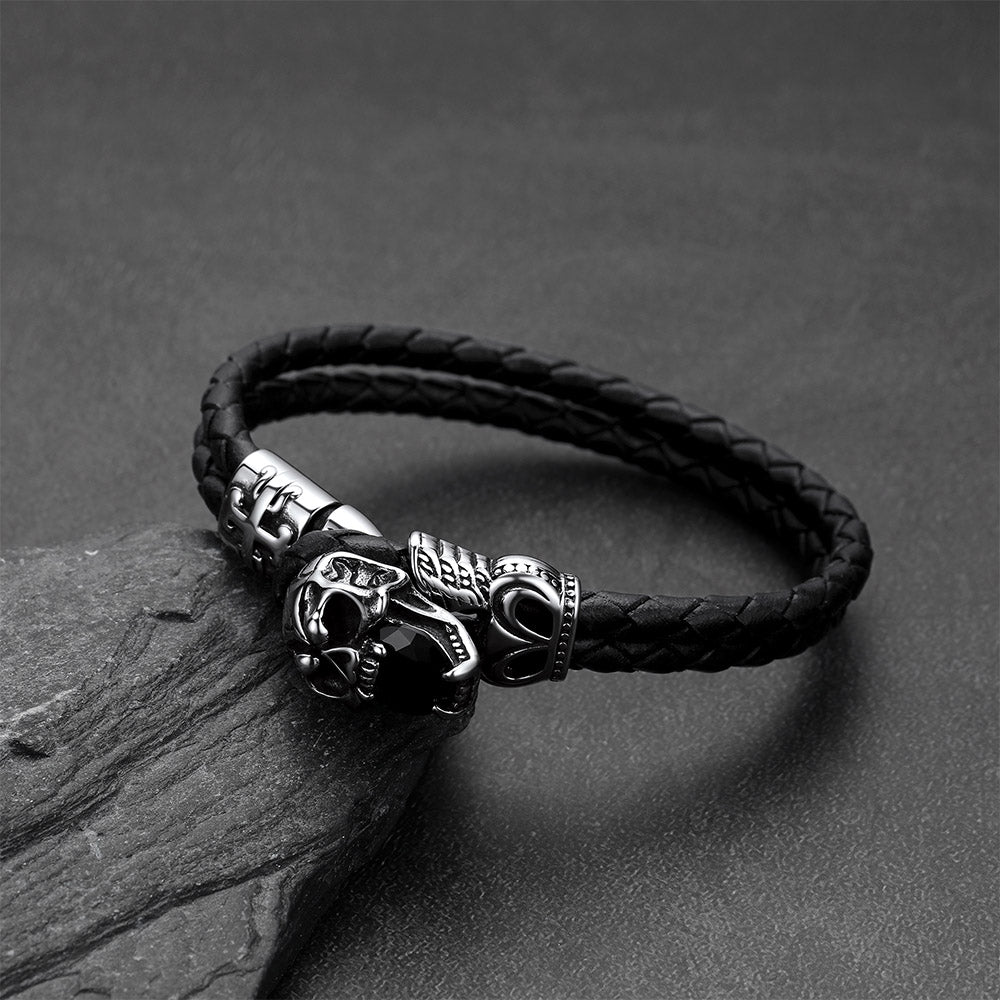 Close-up of vintage skull with crown braided leather