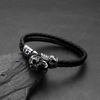 Close-up of vintage skull with crown braided leather