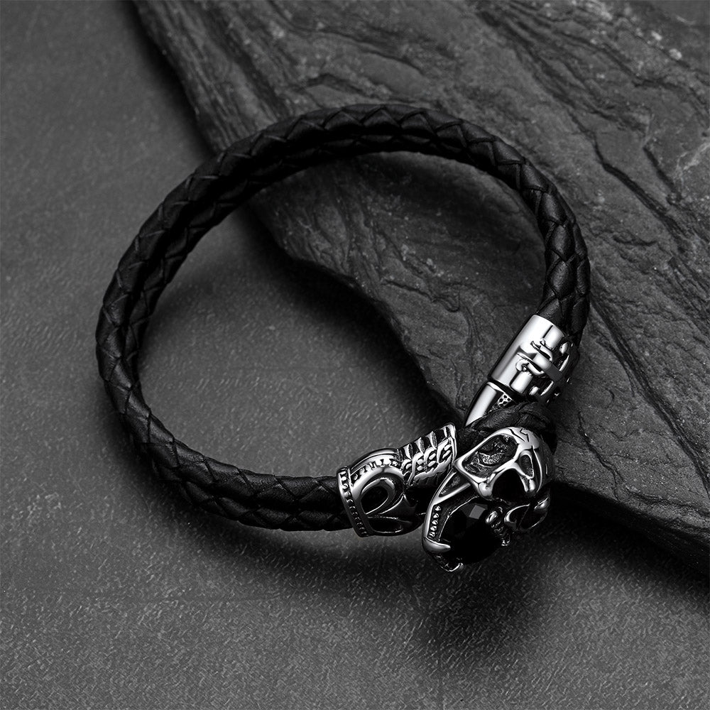 Close-up of vintage skull with crown braided leather
