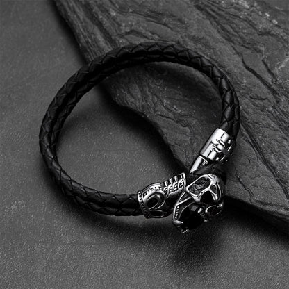 Close-up of vintage skull with crown braided leather