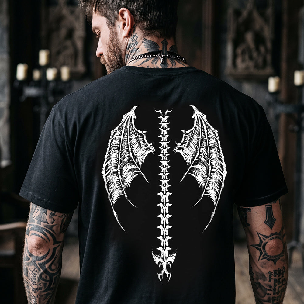A man viewed from behind wearing a black t-shirt with a large white graphic of a winged spine on the back.