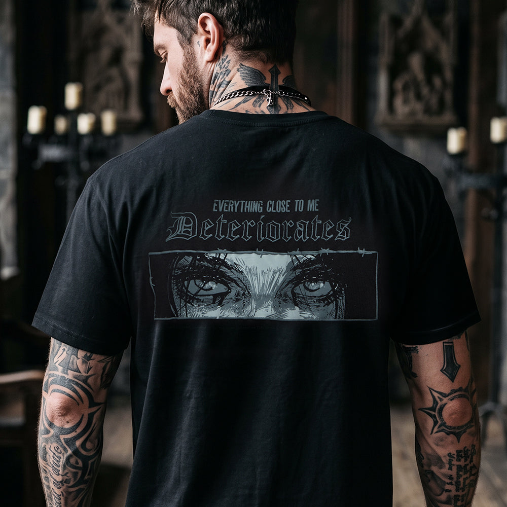 Close-up of Y2K grunge graphic tee with anime eyes and glitch-style deteriorates effect