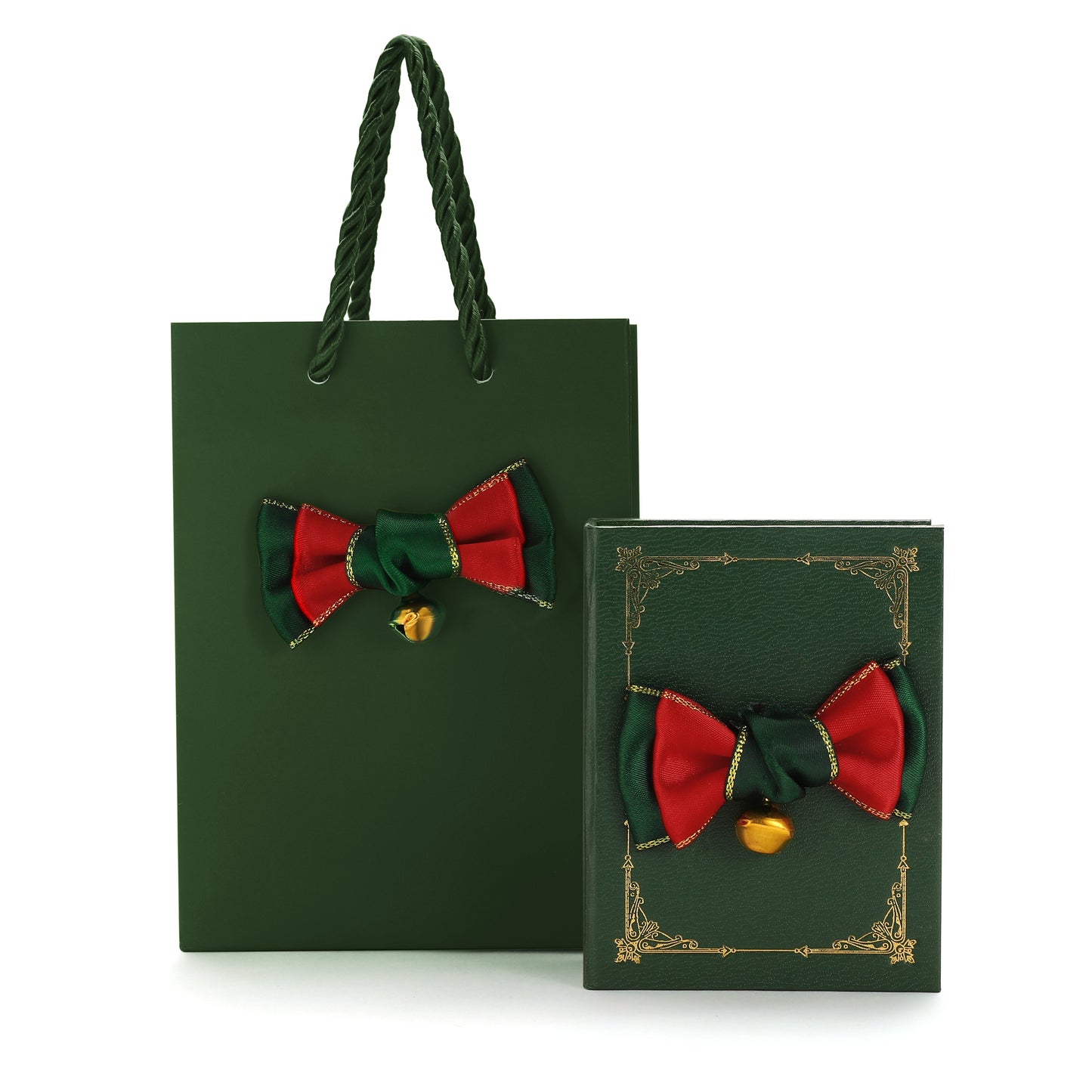 Green gift bag and book with red and green bows and gold bells on a white background