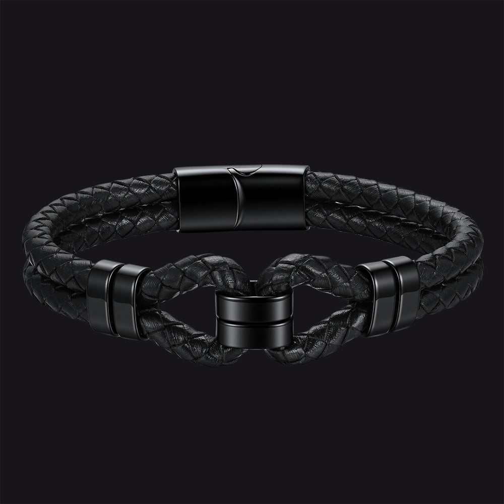 Black braided leather bracelet with a twisted knot design and matte black metal accents, shown on a dark background.