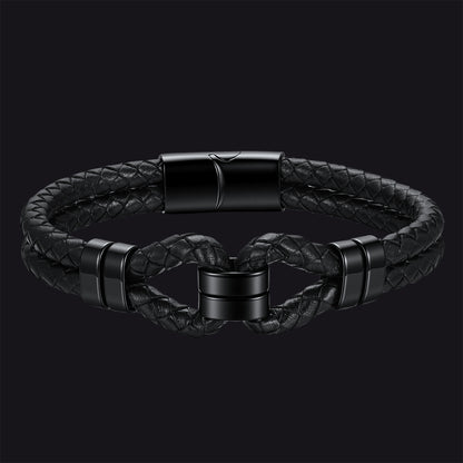 Black braided leather bracelet with a twisted knot design and matte black metal accents, shown on a dark background.