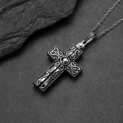 Close-up of folding crucifix cross pendant with Serenity Prayer on chain