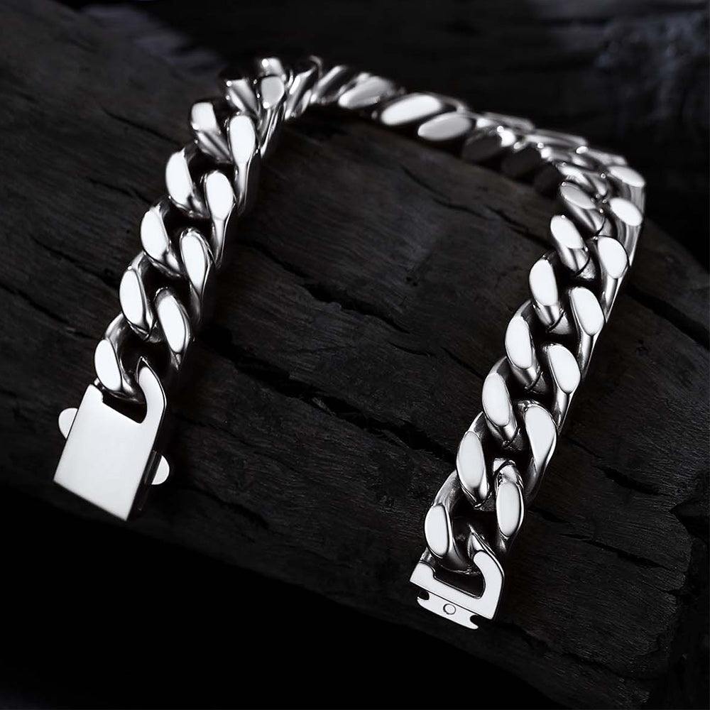 Silver chain bracelet on a dark wooden surface