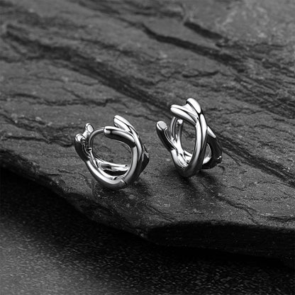 A Pair of silver hoop earrings on a dark stone surfaceMinimalism X-Structure Hoop Earrings for Men