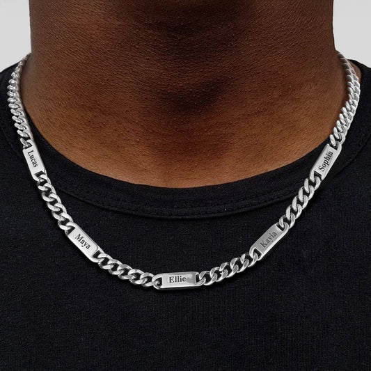 Silver cuban chain name link necklace with engraved names on a black shirtimg