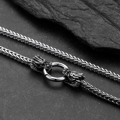 A close-up of a Norse Viking Dragon Head Braided Leather Necklace Cord for Men