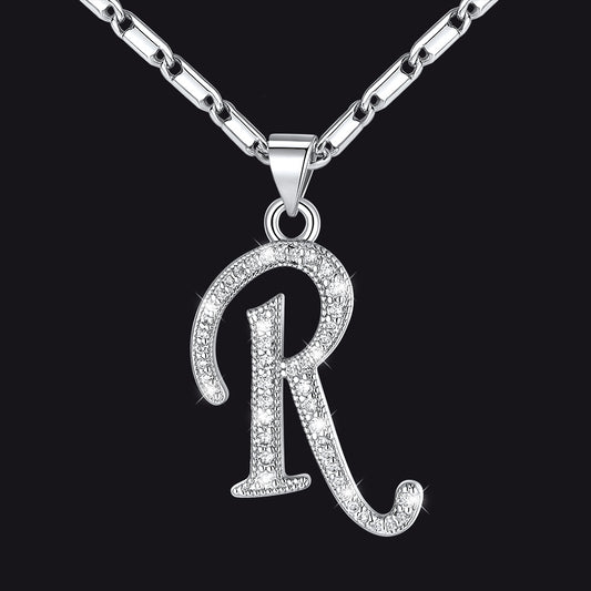 Silver necklace with a 'R' pendant on a black backgroundimg