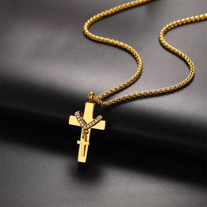 Gold cross pendant necklace on a dark background