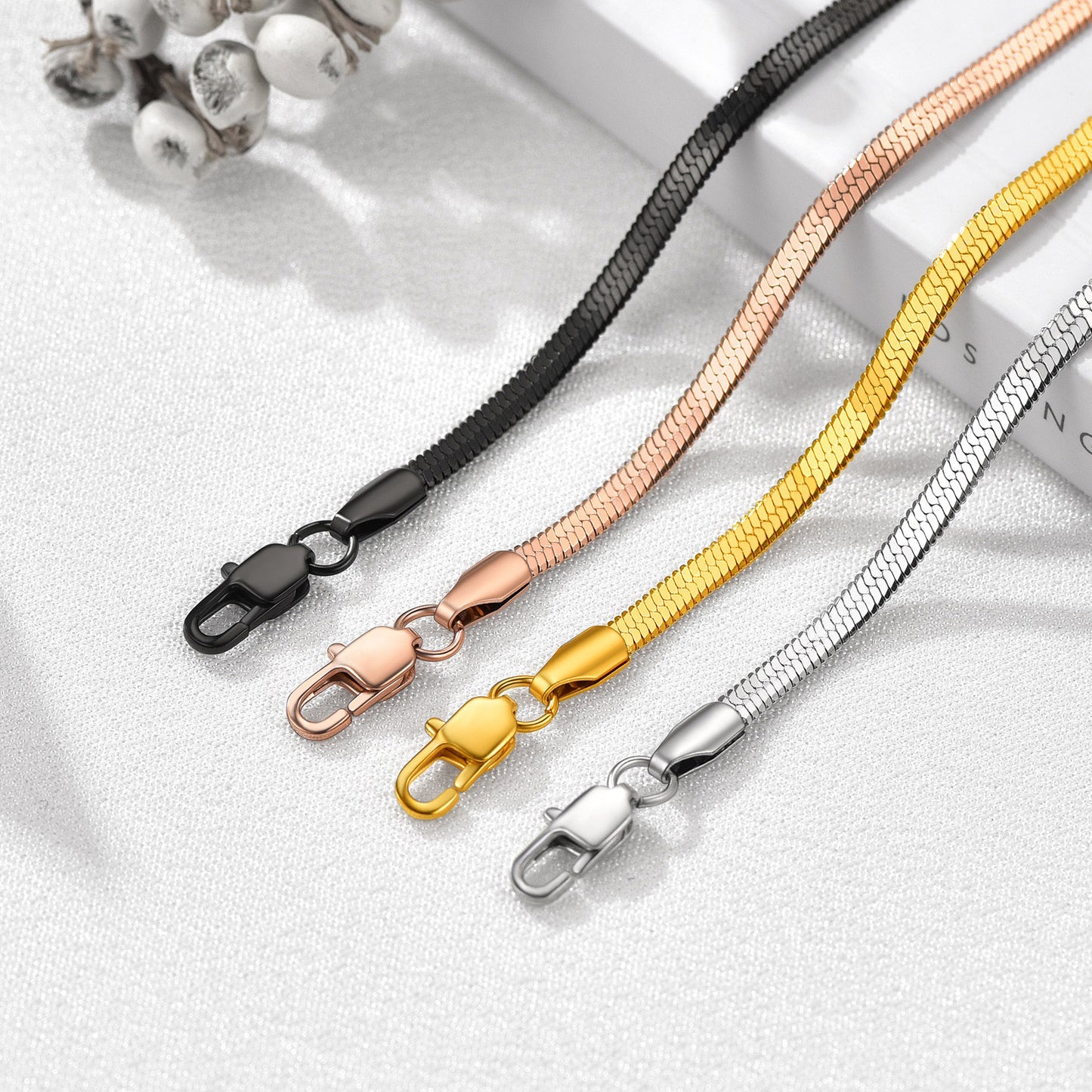 Four snake chain bracelet in black, rose gold, gold, and silver