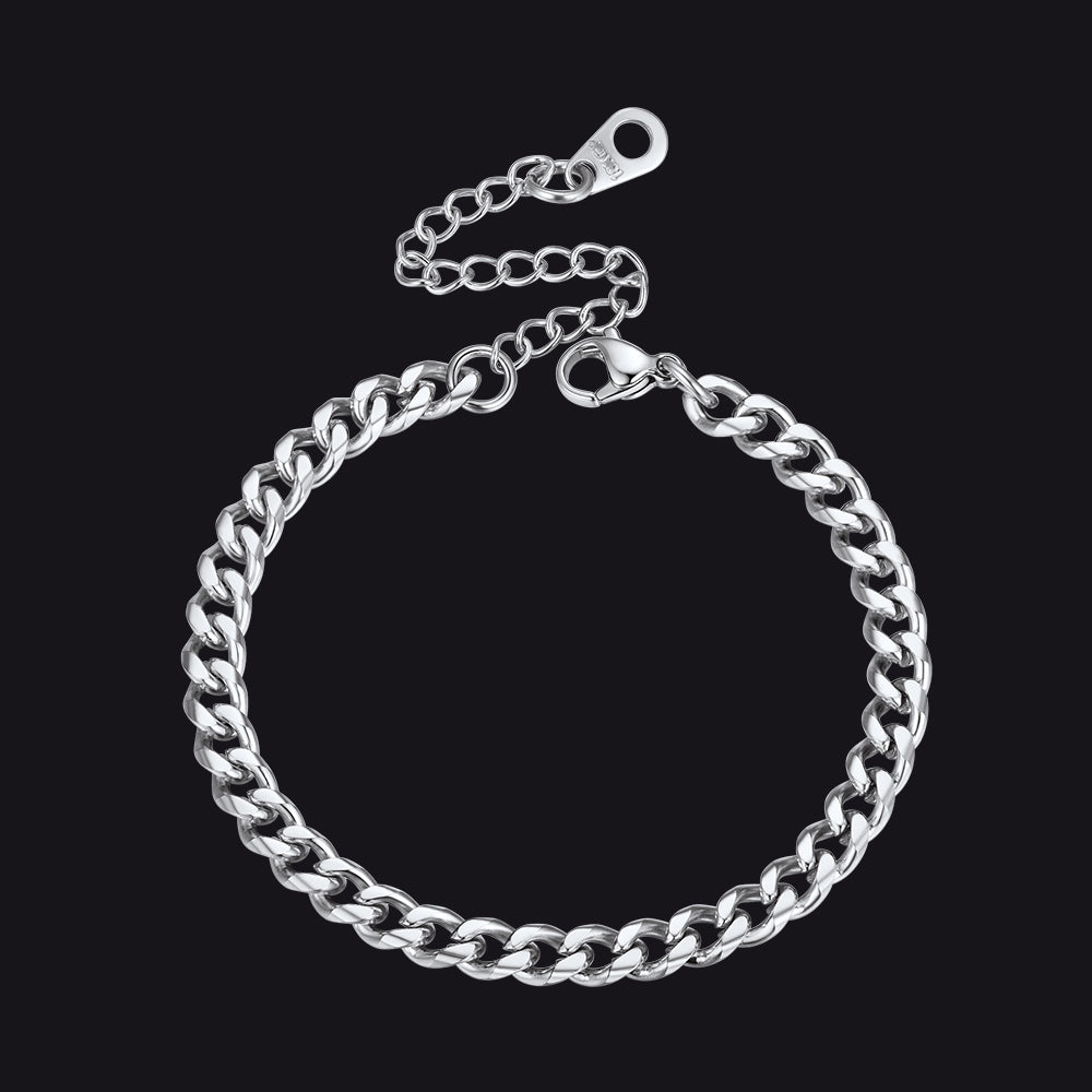Silver chain bracelet on a black background