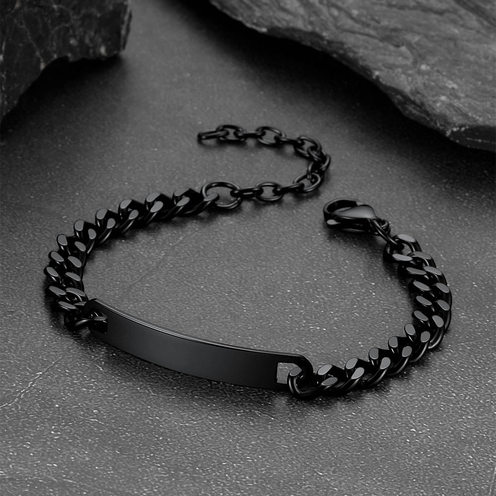 Black chain bracelet on a textured surface