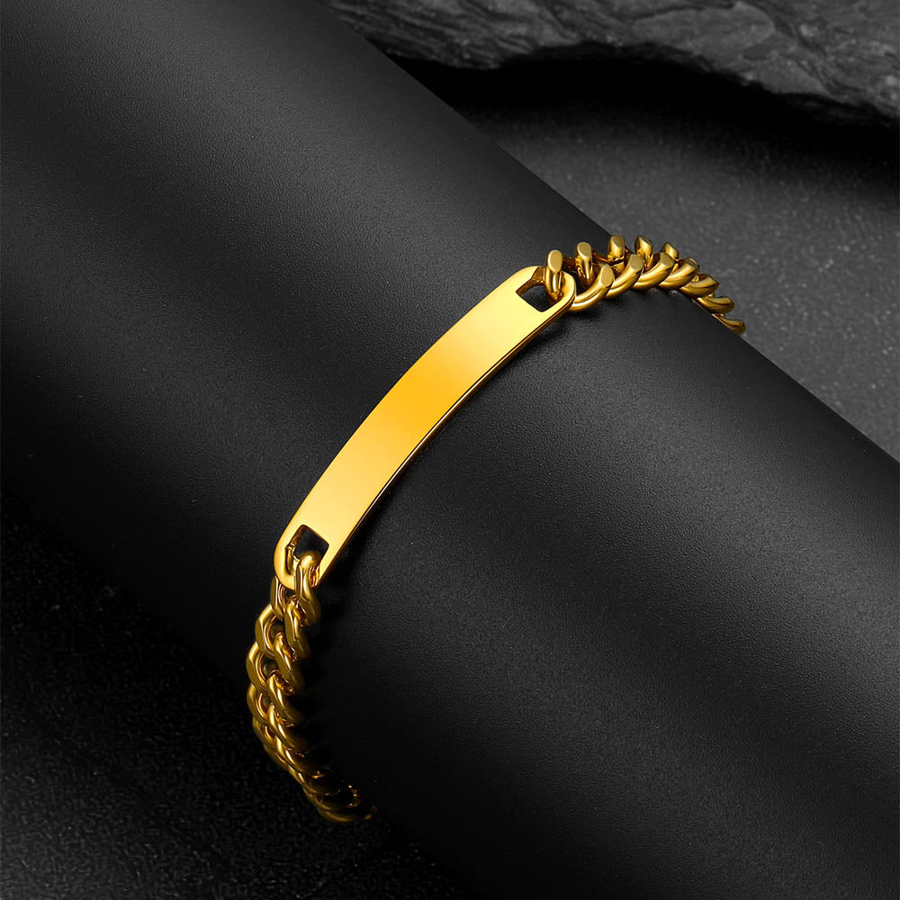 Gold bracelet on a dark fabric background