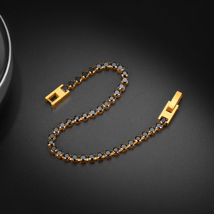 Gold bracelet with black stones on a dark background