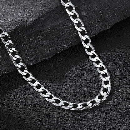 6MM Steel cuban chain necklace on a dark stone surface