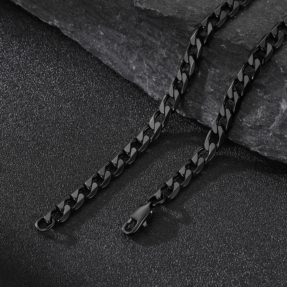 6MM Black cuban chain necklace on a dark stone surface
