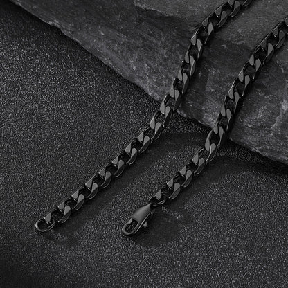 6MM Black cuban chain necklace on a dark stone surface