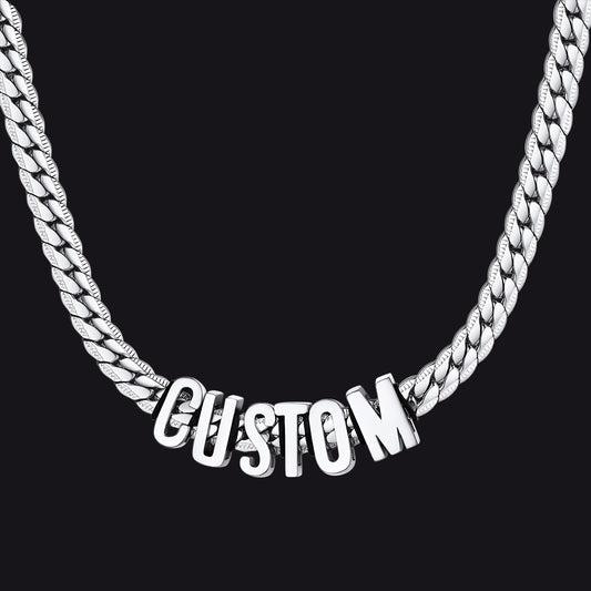 Silver chain necklace with 'CUSTOM' pendant on a black backgroundimg