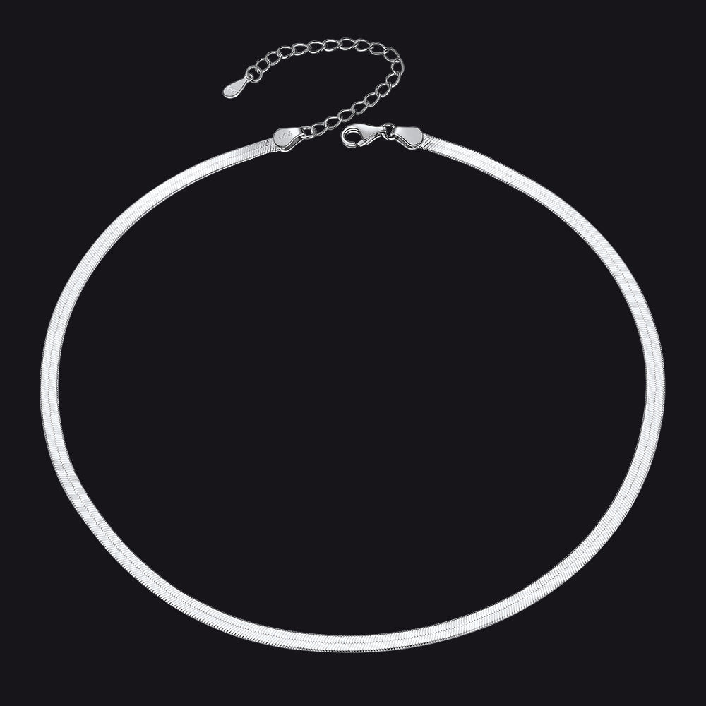 Silver necklace on a black backgroundimg