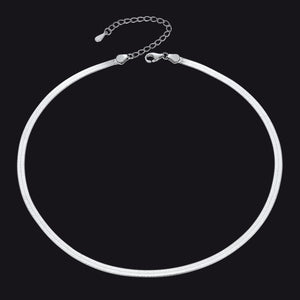 Silver necklace on a black background