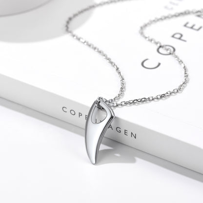 Silver necklace with a pendant on a white stand with 'Copenhagen' branding.