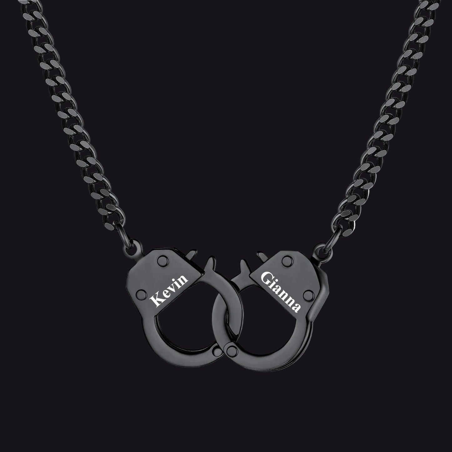 A black metal chain necklace with a pendant shaped like two interlocking handcuffs. 