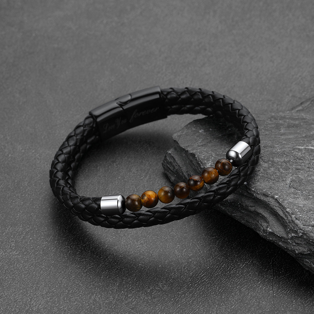 Close-up of natural tiger eye beads and custom engraving on leather bracelet