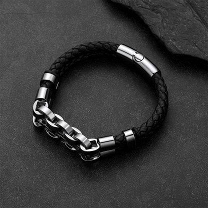 Punk-Gothic style leather bracelet on a dark gray rock background.