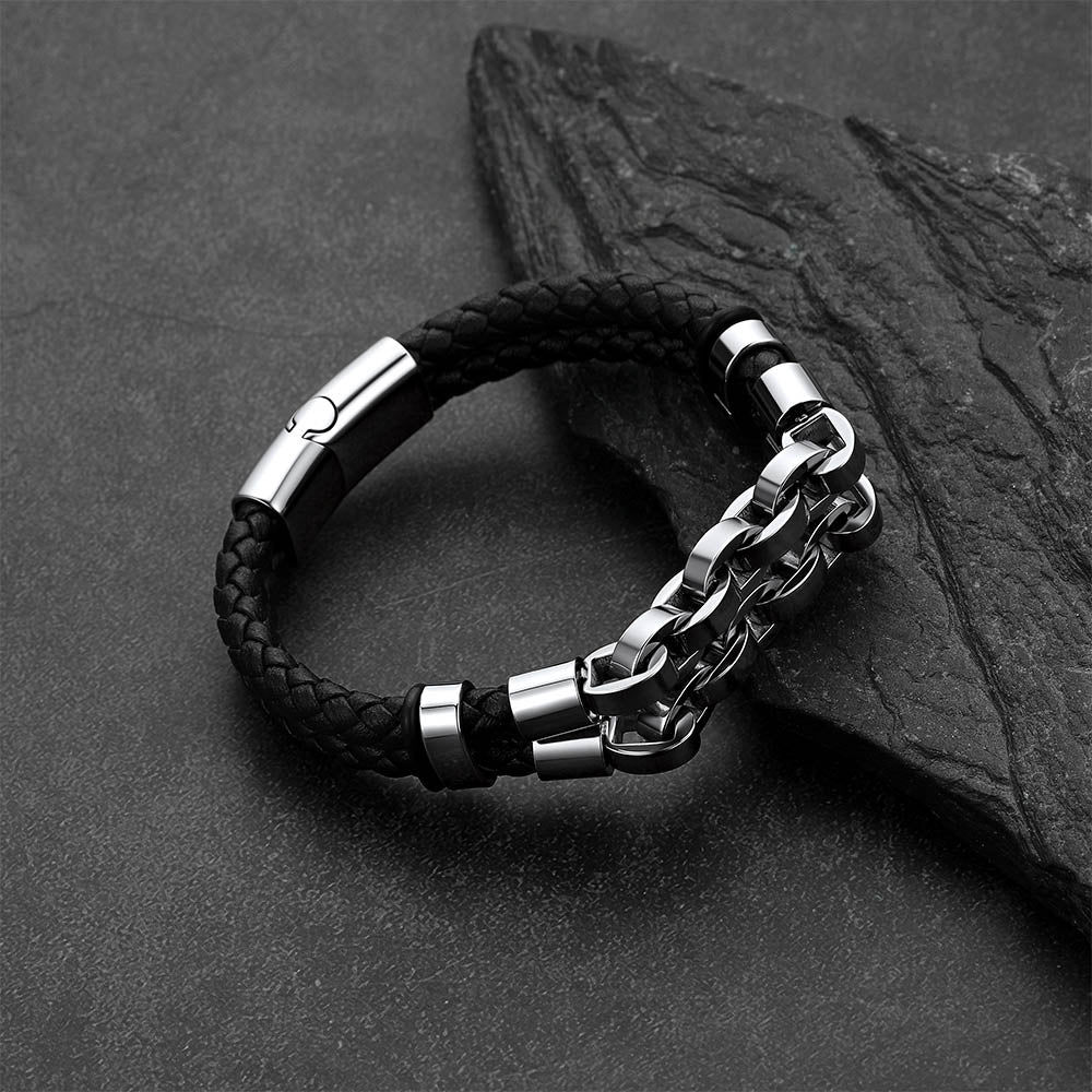 Punk-Gothic style leather bracelet on a dark gray rock background.