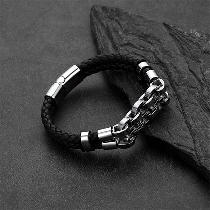Punk-Gothic style leather bracelet on a dark gray rock background.