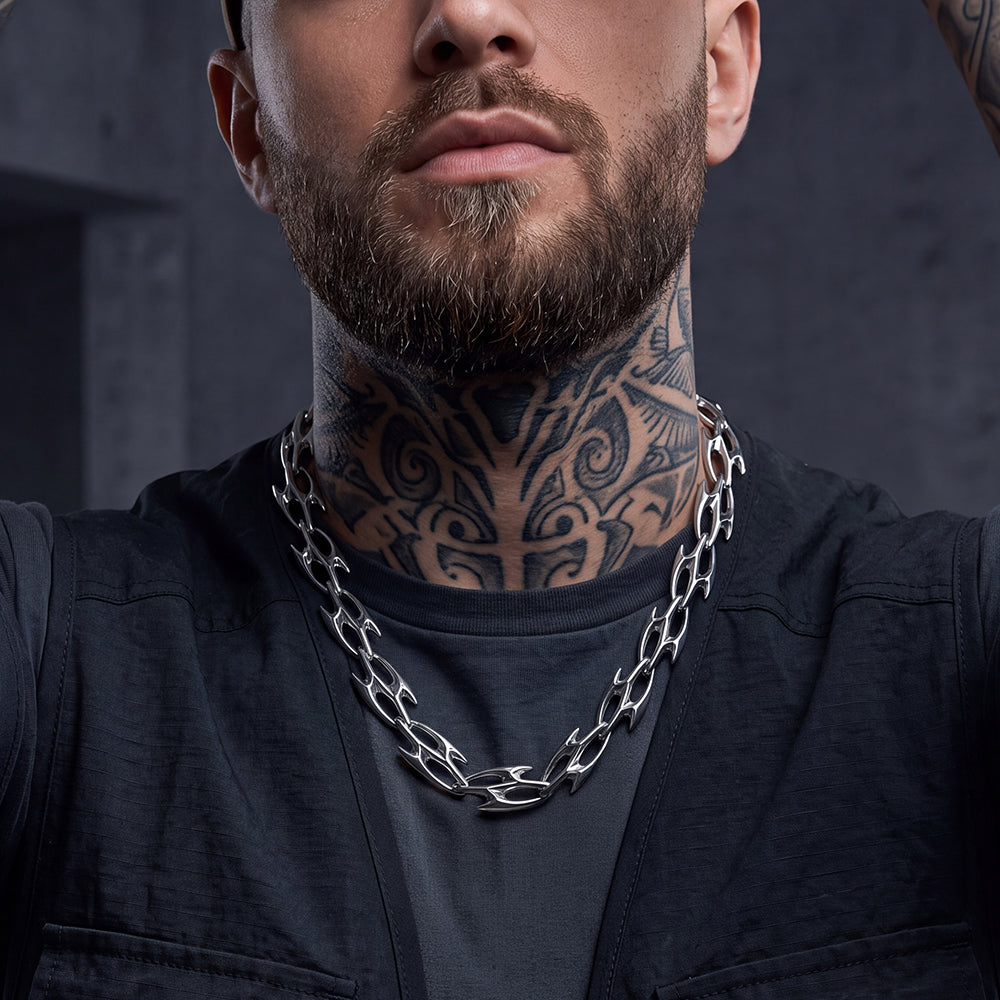 A close-up of a man wearing Liquid Metal Cyber Thorn Chain Necklace