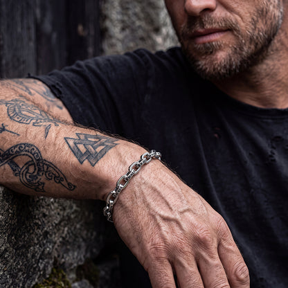 Man wearing punk rock cyberpunk lettering paperclip chain bracelet