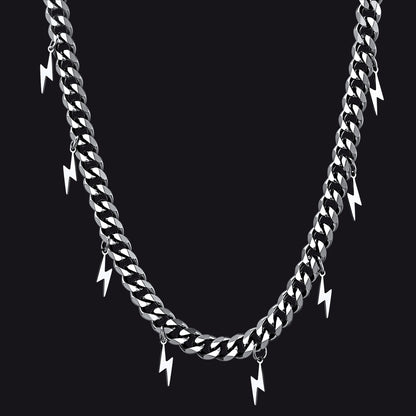 Silver chain necklace with lightning bolt pendants on a black background