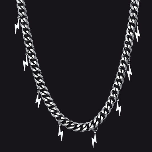 Silver chain necklace with lightning bolt pendants on a black backgroundimg