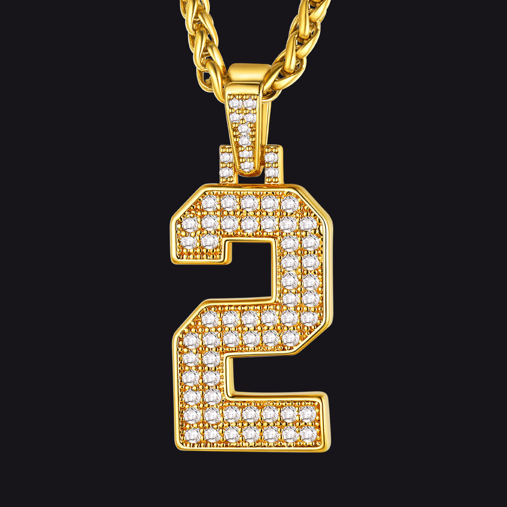 Gold necklace with a diamond-encrusted number '2' pendant on a black background