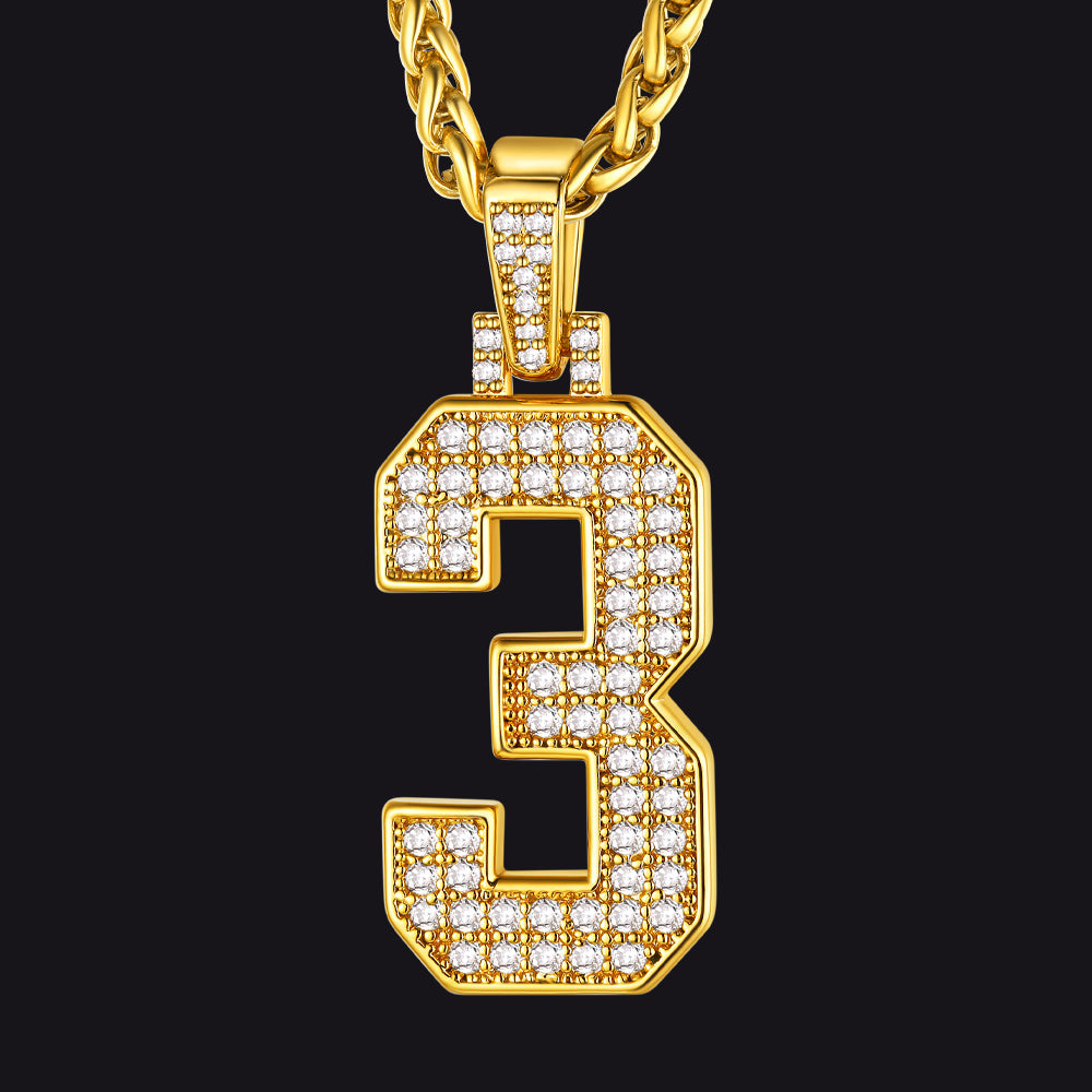 Gold necklace with a diamond-encrusted number '3' pendant on a black background