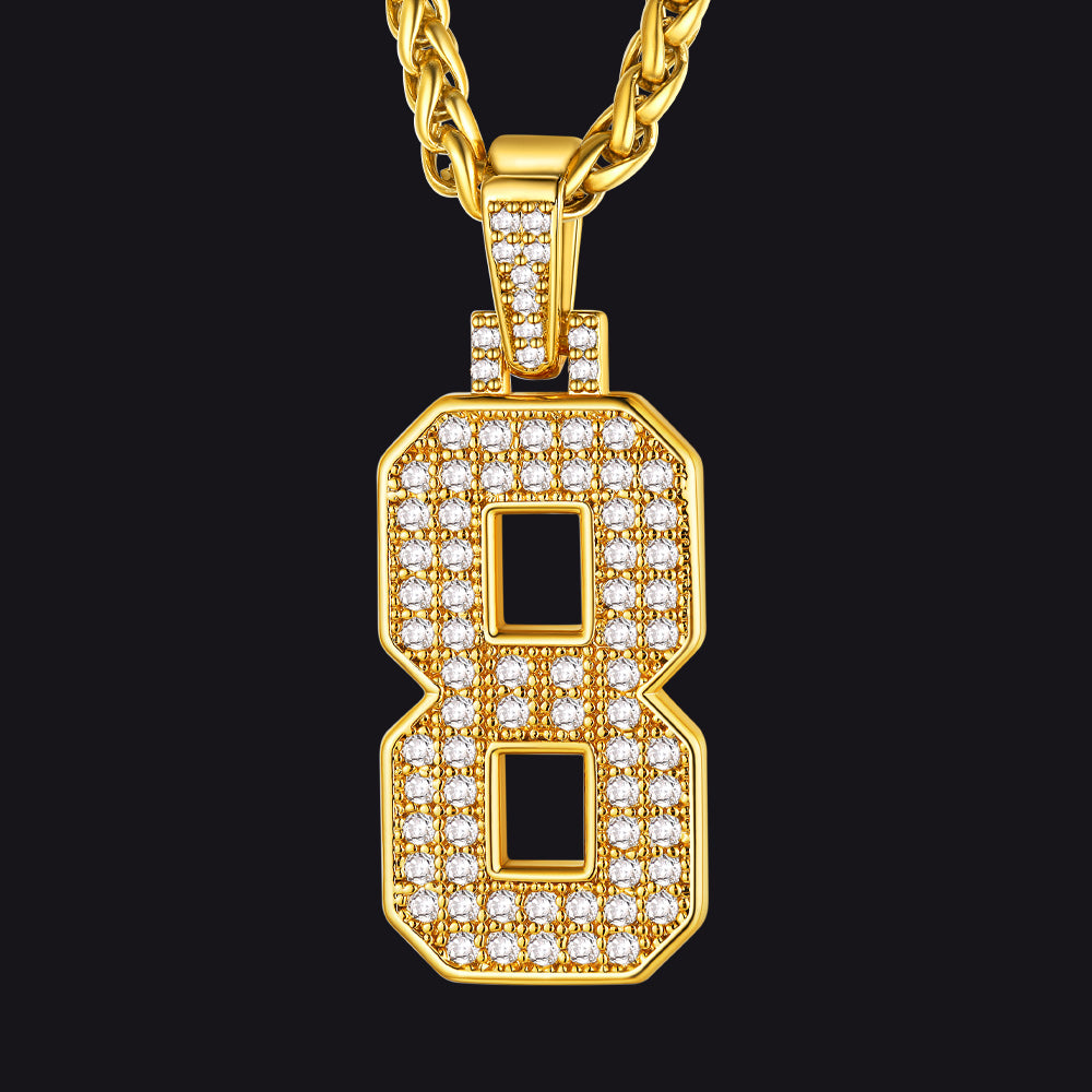 Gold necklace with a diamond-encrusted 'B' pendant on a black background