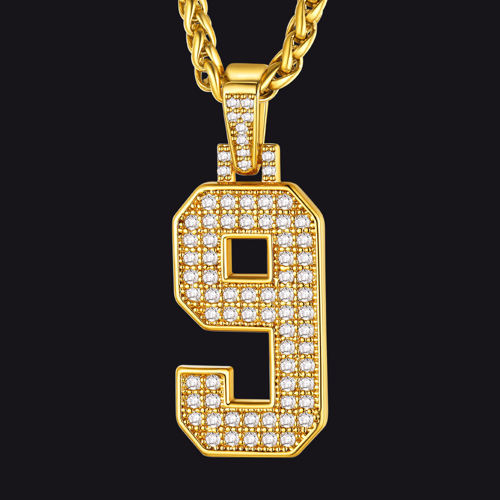 Gold necklace with a letter 'J' pendant on a black background