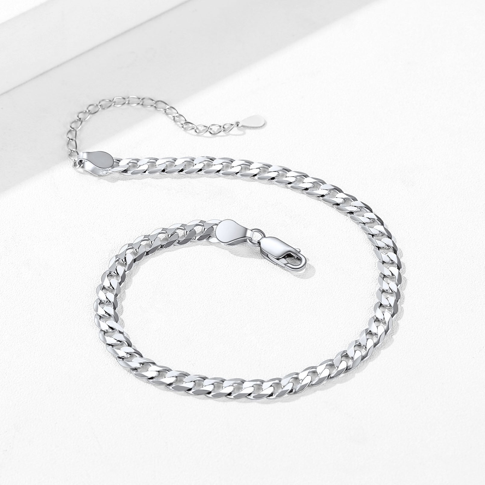 Lobster clasp detail on silver beach anklet