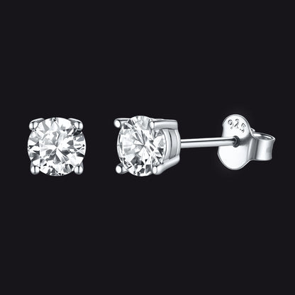Pair of diamond stud earrings on a black background