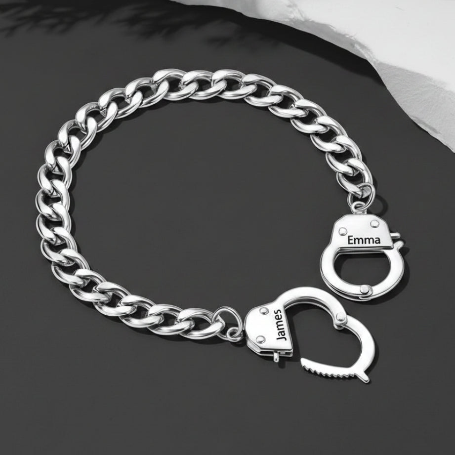 Silver chain bracelet with handcuff charms