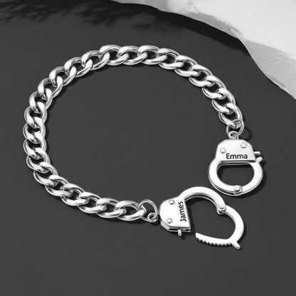 Silver chain bracelet with handcuff charms