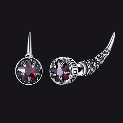 Pair of silver earrings with star-shaped gemstones