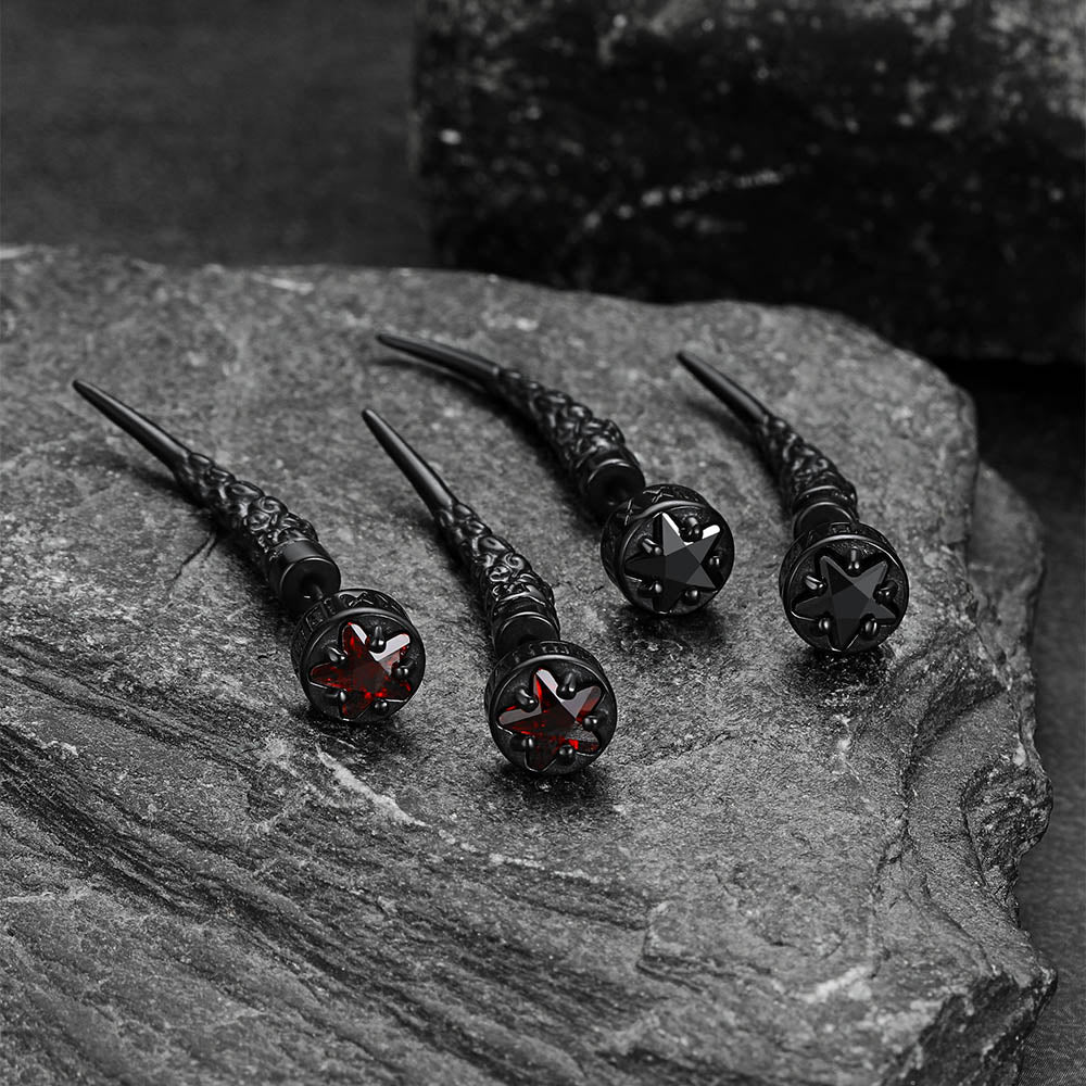 Black decorative nails on a textured stone surface