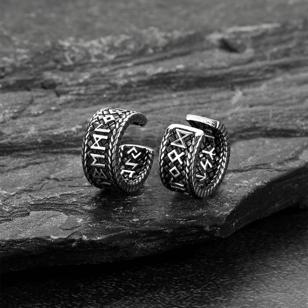 Viking rune ear cuffs displayed on stone backgroun