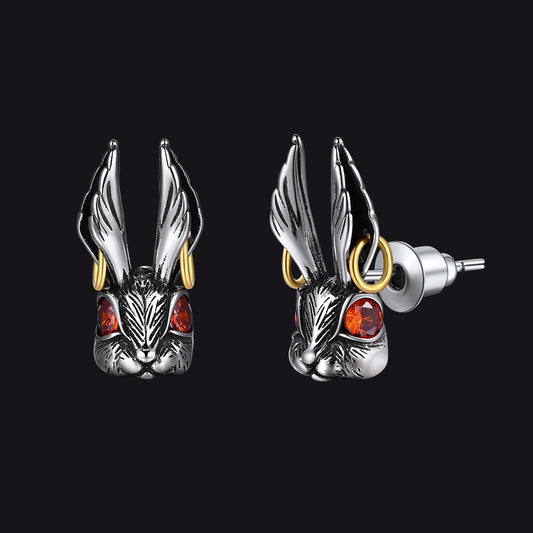 Pair of silver rabbit head earrings with red eyes and gold accentsimg