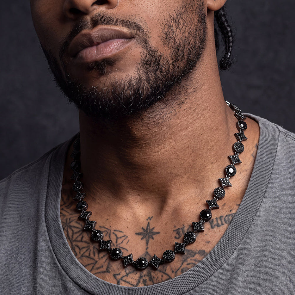 A close-up of a man wearing a Quadrangular Four Pointed Star Link Tennis Necklace
